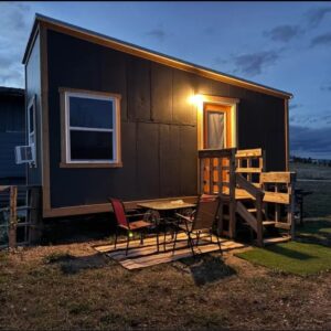 Tiny house with one sleeping loft and one storage loft.